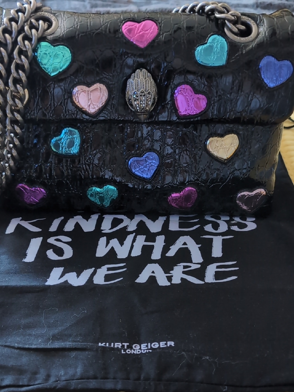 Kurt Geiger Black Croc-Embossed Shoulder Bag with Multicolor Metallic Hearts.